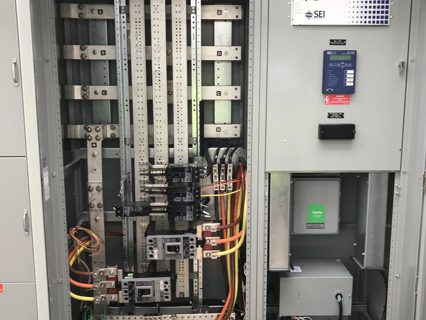 Electrician servicing exterior electrical equipment